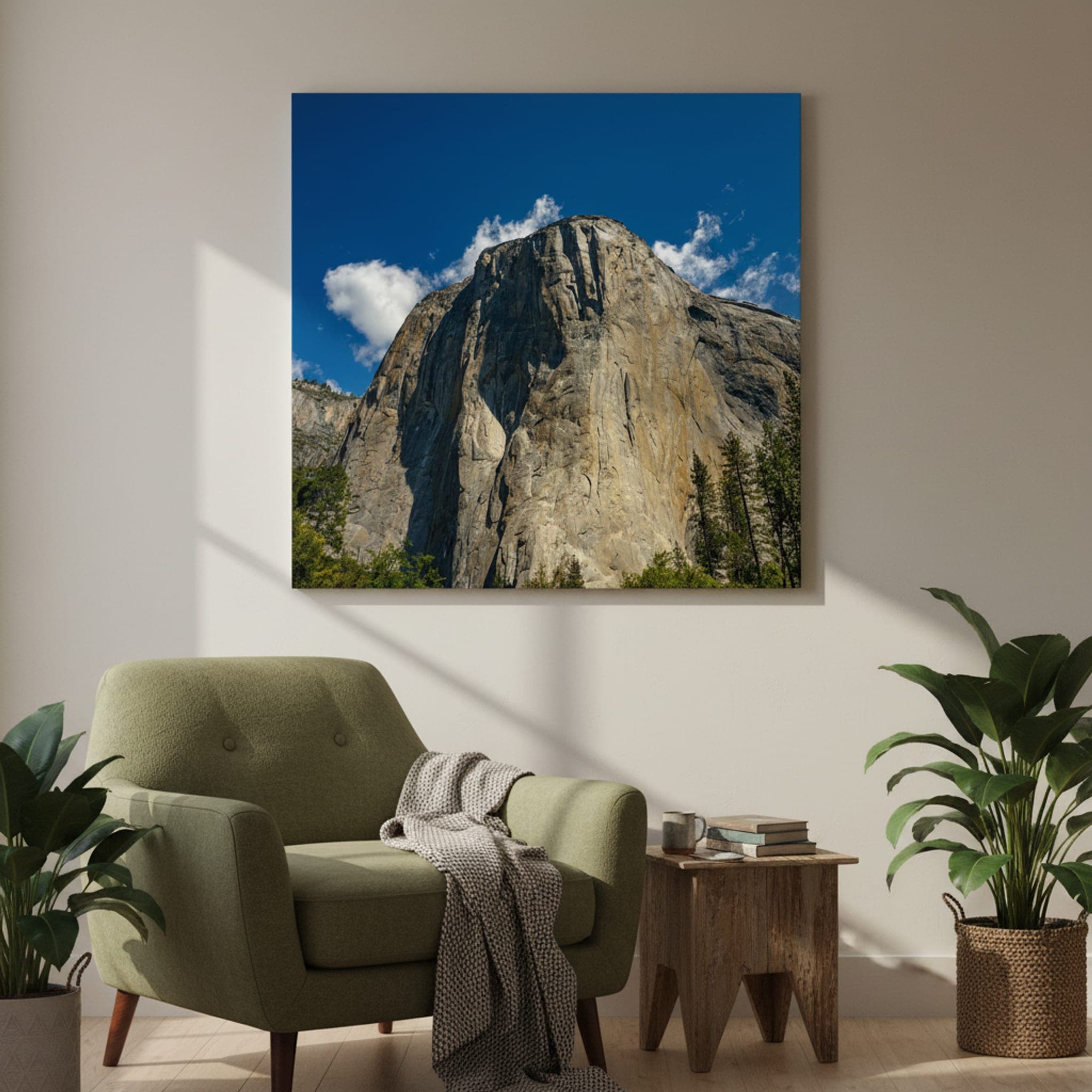 El Capitan's Granite Majesty
The colossal granite face of El Capitan in Yosemite National Park, USA, seen from below under a bright blue sky with scattered clouds.